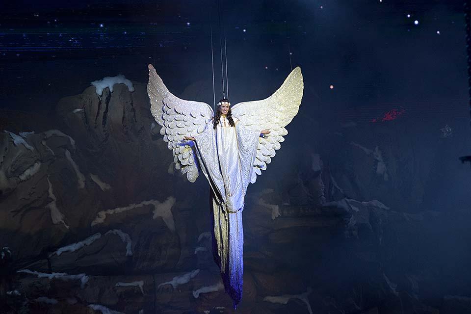 An angel flies during the Stampede Christmas show.